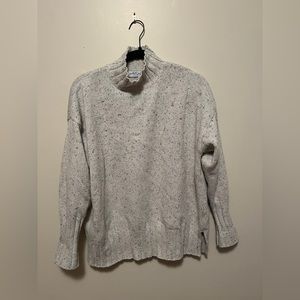 White and black speckled turtleneck oversized